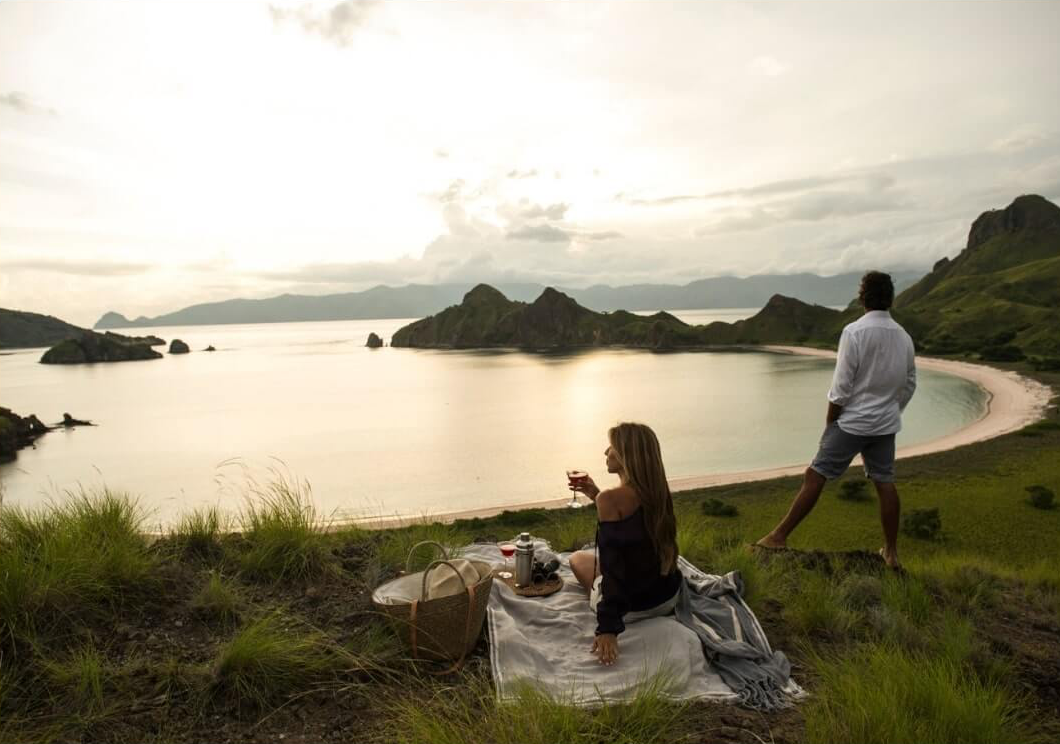 A couple enjoying a coastal picnic