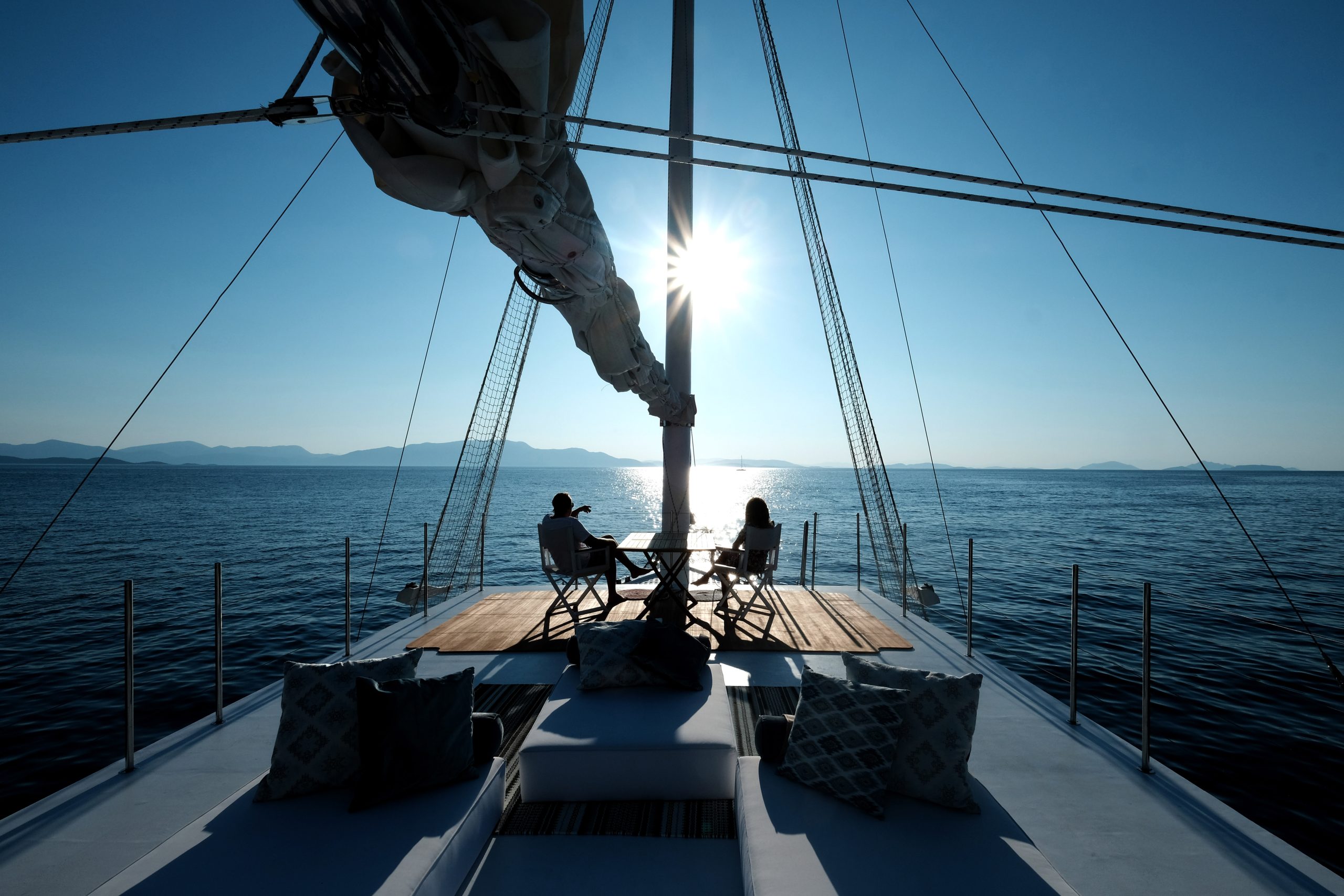 A couple on deck of a private luxury charter in Bali