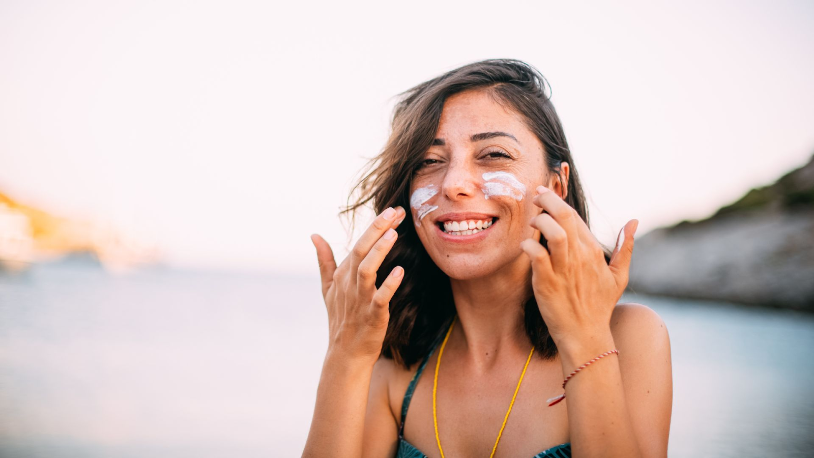 A woman with sunscreen on her face