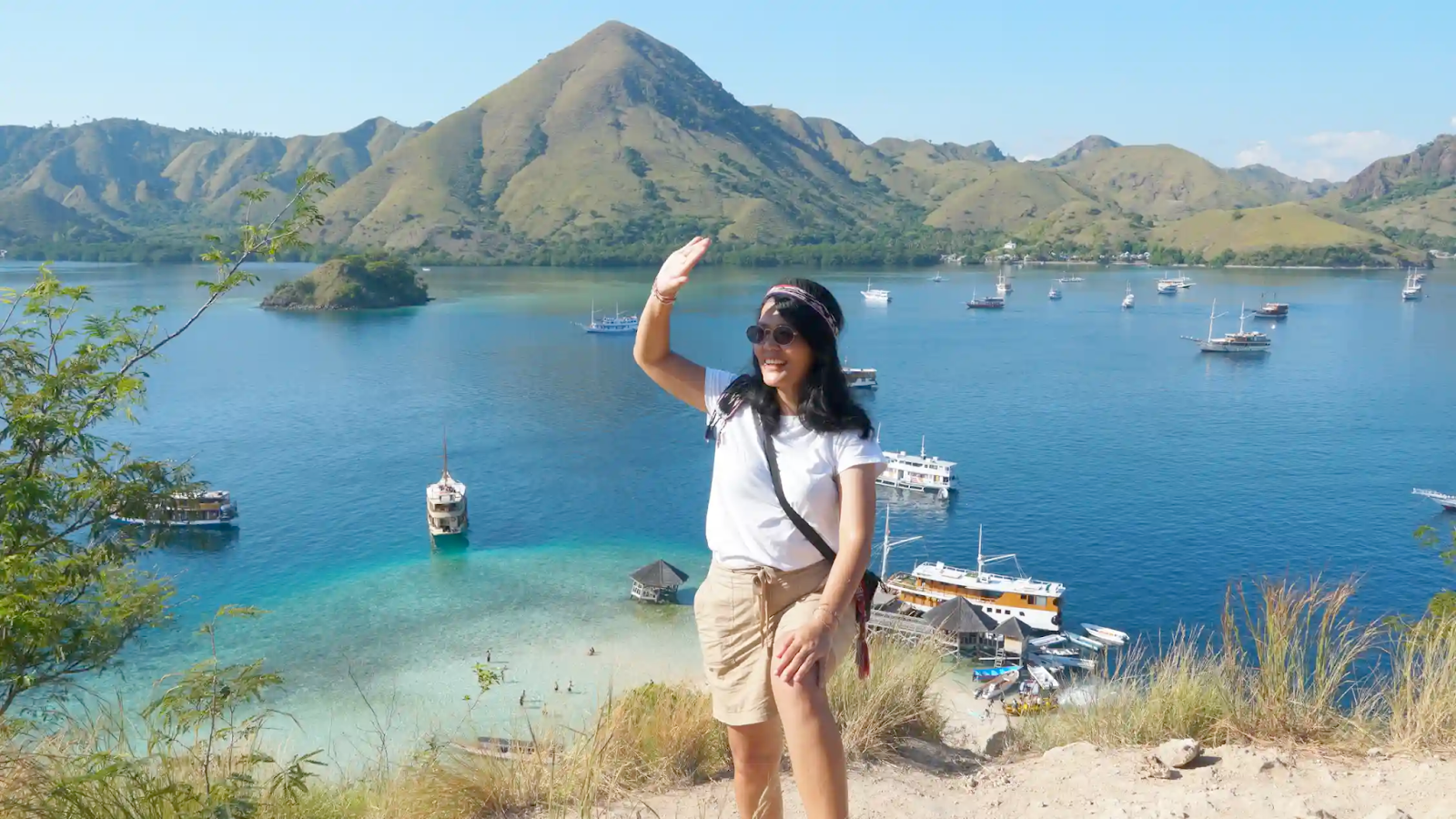 A woman enjoying the view from Kelor Island, Komodo