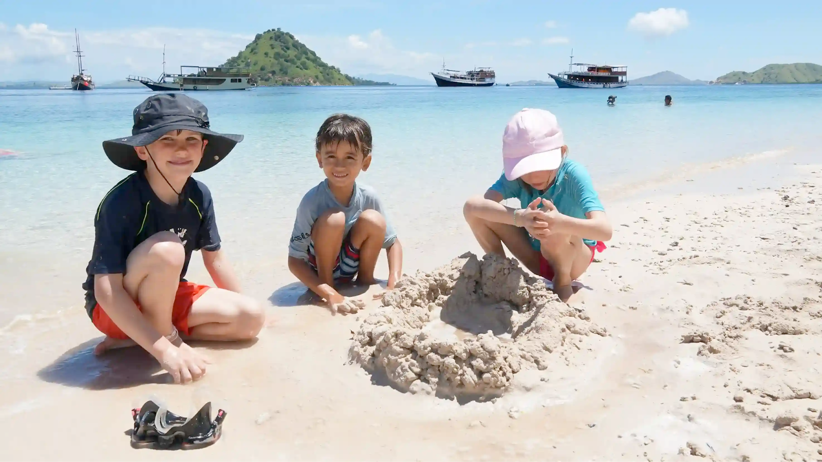 Kids playing on a beach on Kelor Island