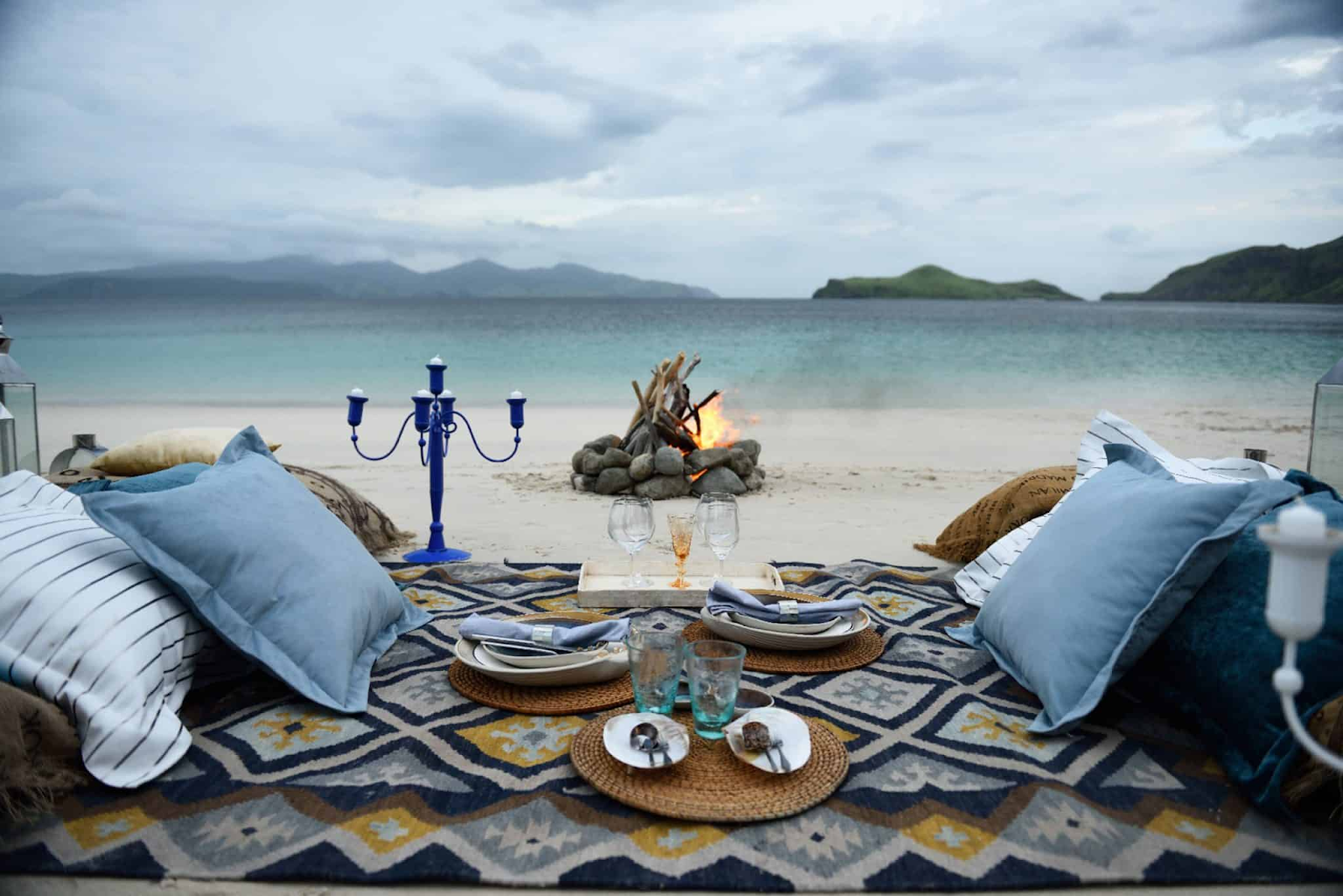 A luxury beach picnic setup by ALEXA Private Cruises in Komodo