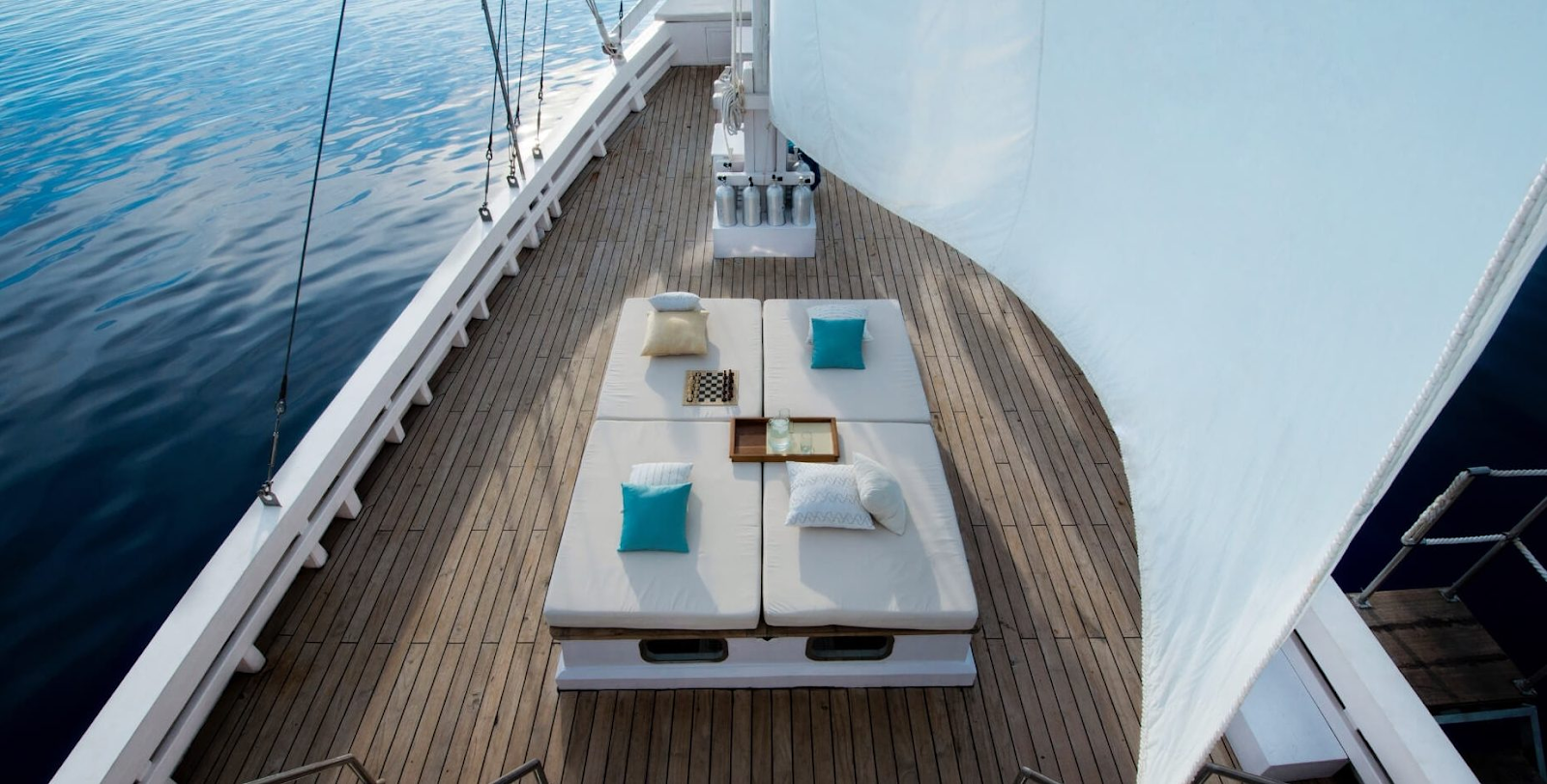 The luxurious day beds on the deck of ALEXA Private Cruises