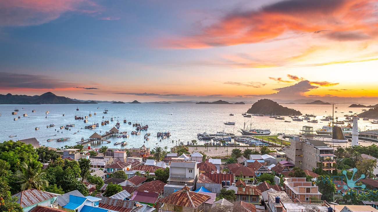 Aerial view of Labuan Bajo town with sunset and surrounding ocean