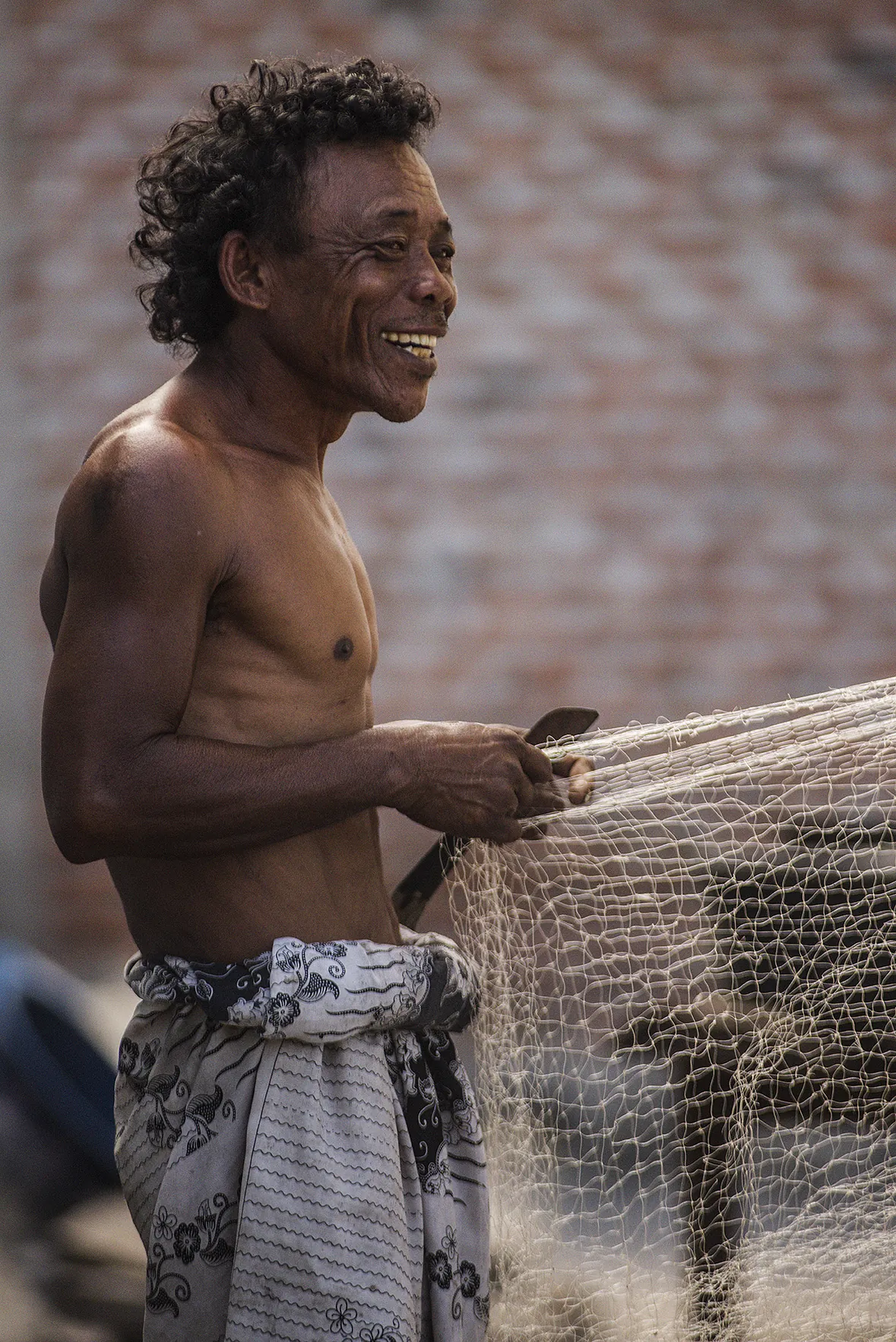 A local man with a fishing net